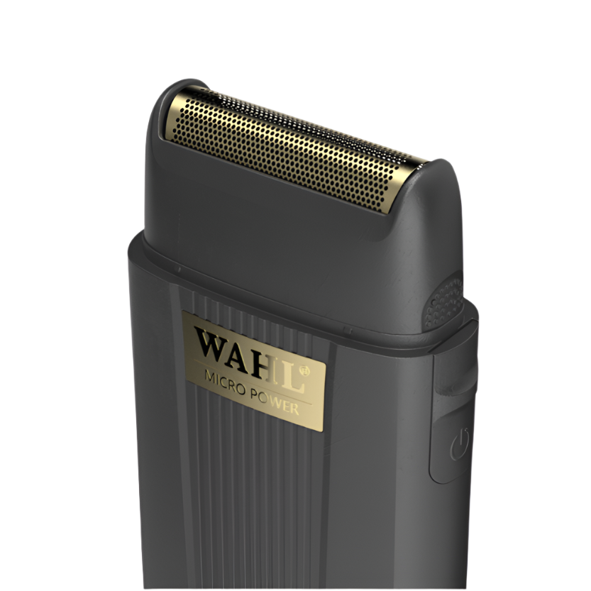 Angled close-up of the Wahl Micro Power single-foil shaver highlighting the gold perforated foil head, black housing, and gold logo, isolated on a transparent background.