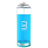 Clear water bottle with blue liquid and silver cap 