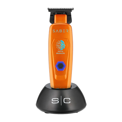 StyleCraft Saber SC421O cordless trimmer in orange on charging stand